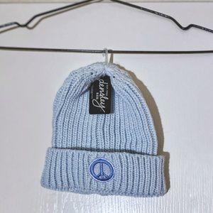 DENSLEY & CO light blue toque hat with a peace sign patch